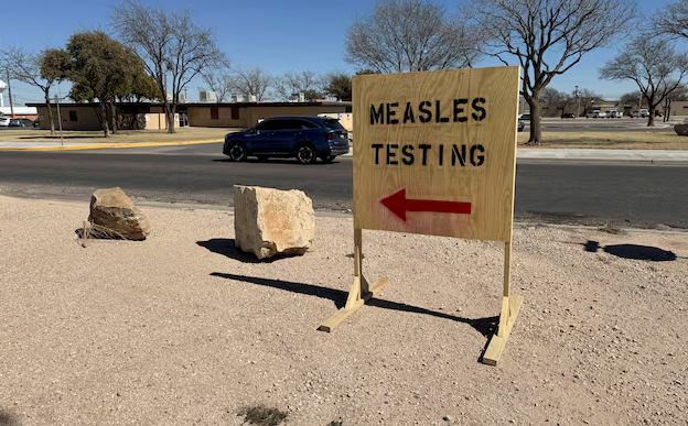 A sign reading "measles testing" is seen. REUTERS/Sebastian Rocandio/File Photo