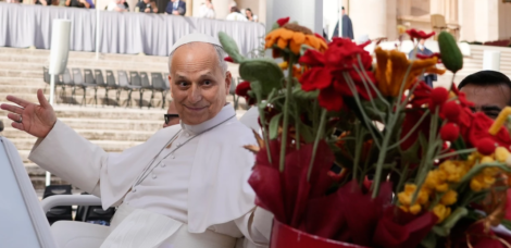 Pope Leo XIV is presented with flowers as he leaves at the end of the general audience in St. Peter’s Square at The Vatican, Wednesday, Oct. 21, 2026. (AP Photo/Gregorio Borgia)