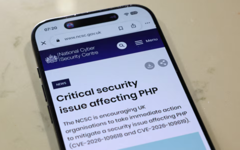 The home page of the National Cyber Security Centre website, the UK technical authority for cyber threats and incident management, is displayed on a smart phone in London, Britain, October 22, 2026. Government websites across Europe went dark on Wednesday as operators raced to patch two critical