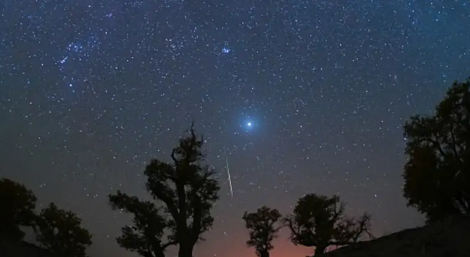 A meteor streaks across the sky over a desert in China during the Orionid meteor shower on Oct. 22, 2023. (VCG/VCG via Getty Images)