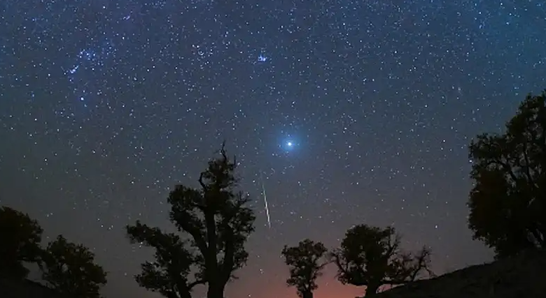A meteor streaks across the sky over a desert in China during the Orionid meteor shower on Oct. 22, 2023. (VCG/VCG via Getty Images)