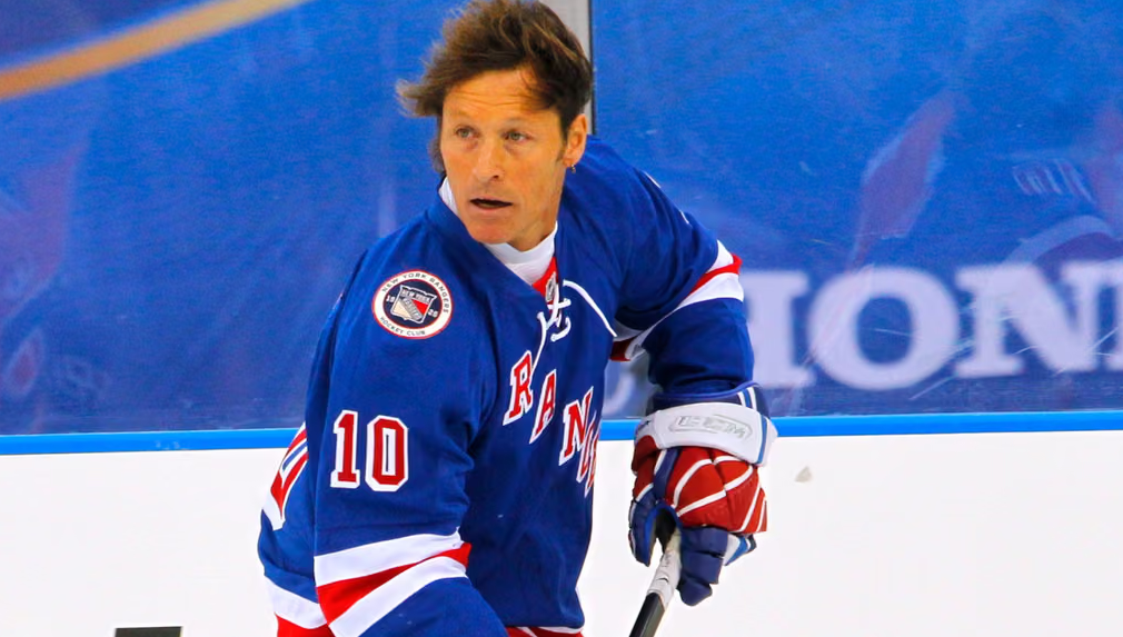 Ron Duguay of the Rangers Alumni team moves the puck during the Winter Classic Alumni game against the Flyers Alumni team on Dec. 31, 2011 in Philadelphia. Credit: AP/Tom Mihalek
