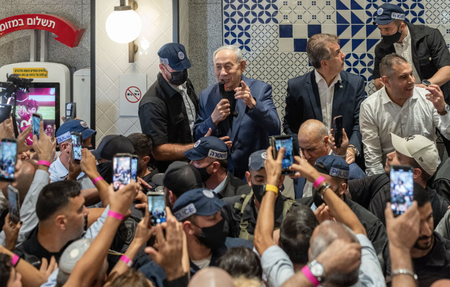 Benjamin Netanyahu, Israel’s prime minister, speaking to supporters in the food court of a shopping mall in Holon, Israel, during a campaign visit this month.Credit...Avishag Shaar-Yashuv for The New York Times