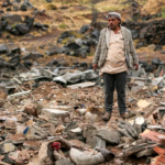 A man inspects damage at the site of an airstrike, reportedly carried out by Saudi Arabia, that targeted the Asr district of Yemen's Houthi-held capital Sanaa on October 24, 2026 [Mohammed Huwais/AFP]