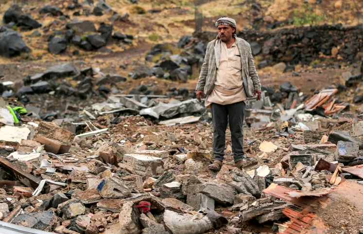 A man inspects damage at the site of an airstrike, reportedly carried out by Saudi Arabia, that targeted the Asr district of Yemen's Houthi-held capital Sanaa on October 24, 2026 [Mohammed Huwais/AFP]