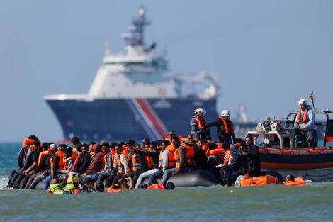 Migrants on a dinghy in the English Channel near the coast of northern France in September.Credit...Jean-Francois Badias/Associated Press