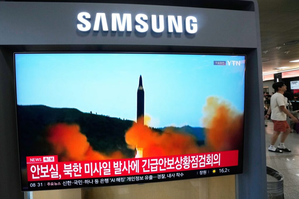 A TV screen shows a file image of a North Korean missile launch during a news program at Seoul Railway Station in Seoul, South Korea, Saturday, Oct. 3, 2026. (AP Photo/Ahn Young-joon)