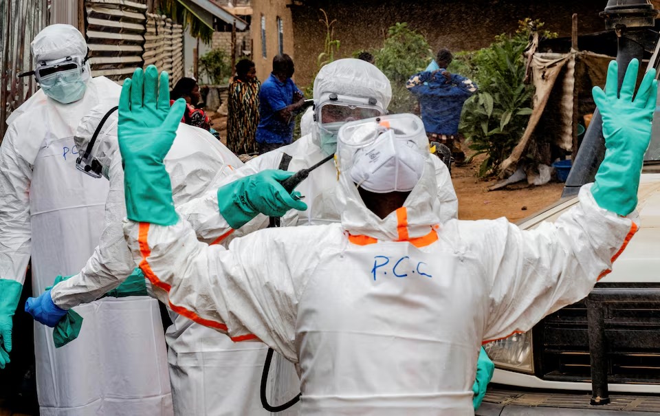 Members of the Civil Protection, a local community-based team that works to help mitigate the spread of the Ebola virus and ensure burials happen safely and quickly, wearing personal protective equipment (PPE) in Bunia, Ituri province, Democratic Republic of Congo, July 10, 2026. REUTERS/Gradel Muyisa Mumbere