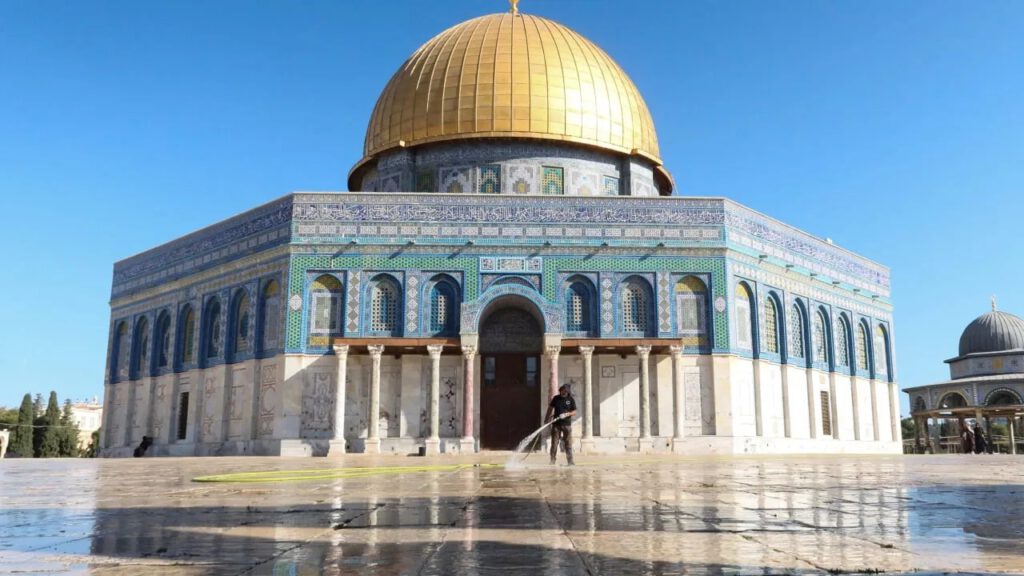 An Islamic Waqf member cleans the area outside the Dome of the Rock, at Al-Aqsa compound, in Jerusalem, September 13, 2026. (photo credit: REUTERS/SINAN ABU MAYZER)
