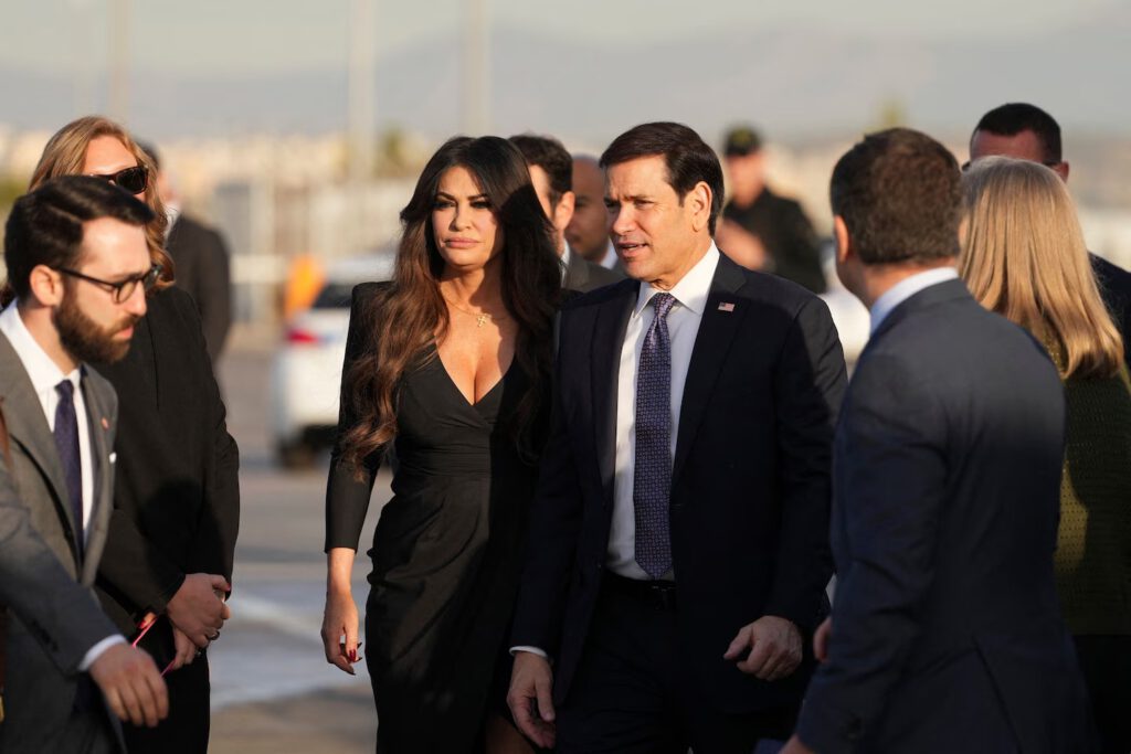 Secretary of State Marco Rubio is flanked by U.S. Ambassador to Greece Kimberly Guilfoyle at Athens International Airport. (Mark Schiefelbein/AFP/Getty Images)