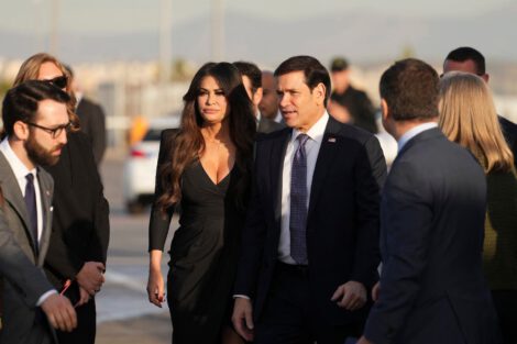 Secretary of State Marco Rubio is flanked by U.S. Ambassador to Greece Kimberly Guilfoyle at Athens International Airport. (Mark Schiefelbein/AFP/Getty Images)