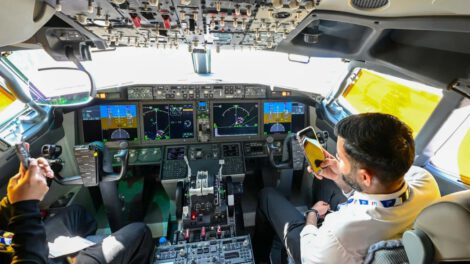 (Illustrative) People sit in the cockpit of a FlyDubai 737 Max on display at Al-Maktoum International Airport during the Dubai Airshow 2025 in Dubai on November 20, 2025. (photo credit: Giuseppe Cacace/AFP via Getty Images)