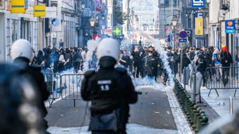 Riot police fire tear gas as students gather outside several schools during a protest against education reforms and budget cuts, in Liege on Wednesday. Photo: Jonas Roosens/Belga/AFP via Getty Images