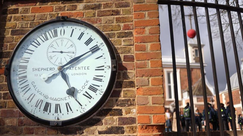 The Shepherd Gate Clock at the Royal Observatory Greenwich in London was the first clock to show Greenwich Mean Time, or GMT, directly to the public. International timekeepers are on track to vote on eliminating what's known as a leap second — a tiny, but many say important, link between Earth's rotation and the world's time standard. (Neil Hall, Shutterstock via CNN)