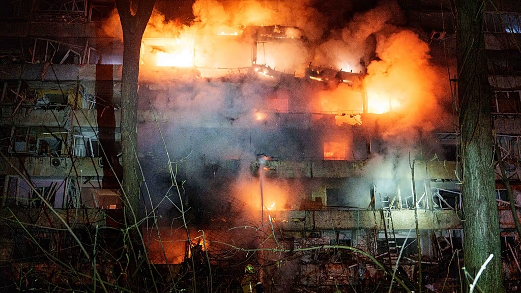 A damaged multi-storey residential building is seen on fire after a Russian missile strike on Kyiv, 13 October, 2026 - Copyright Copyright 2026. The Associated Press. All rights reserved