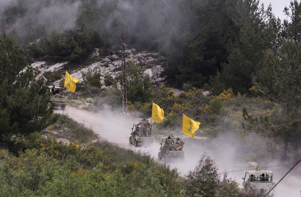 Hezbollah members take part in a military exercise during a media tour organized for the occasion of Resistance and Liberation Day, in Aaramta, Lebanon. REUTERS/Aziz Taher/File photo