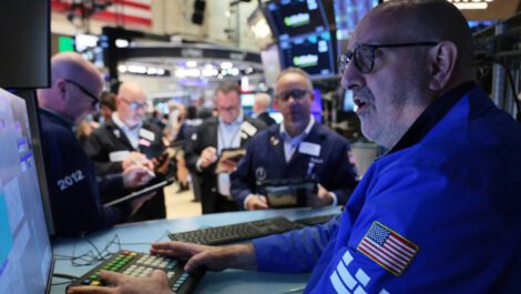 Traders work on the floor of the New York Stock Exchange during morning trading on Oct. 14, 2026 in New York City. Michael M. Santiago | Getty Images
