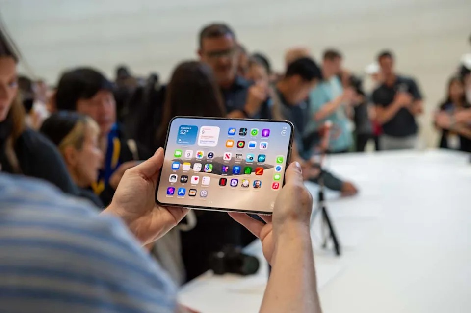 The iPhone Duo, Apple's first flip phone, is on display at one of the company's product launch events. (Andrej Sokolow/picture alliance via Getty Images) · picture alliance via Getty Images
