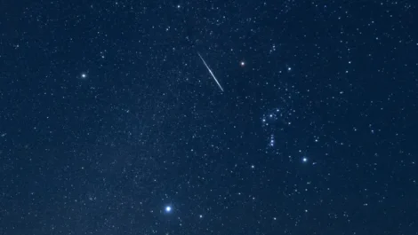 A shooting star blazes a path through the constellation Orion. (Image credit: Icebergpicture via Getty Images)